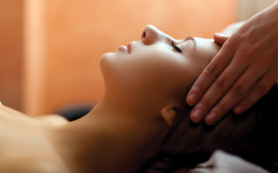Woman receiving a head massage
