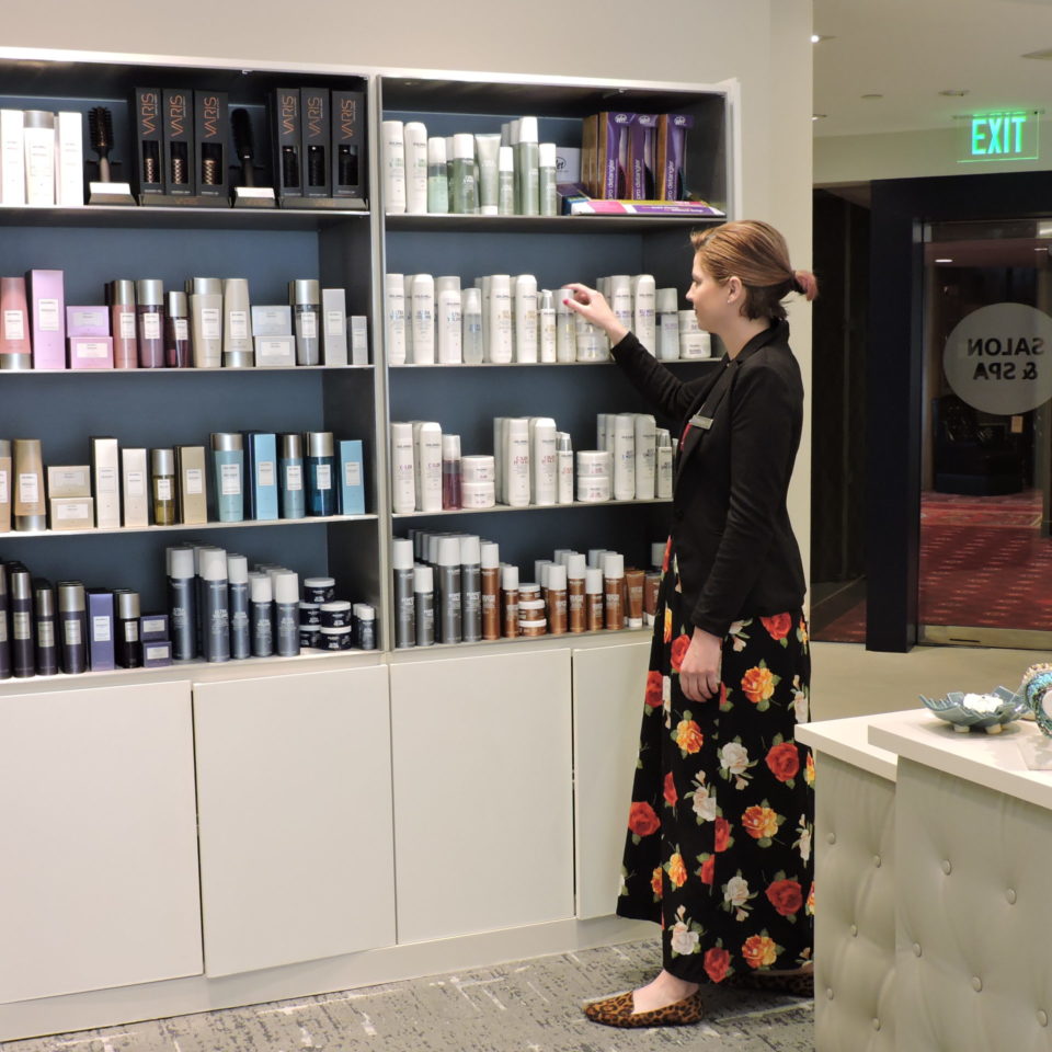Woman shopping products inside the salon