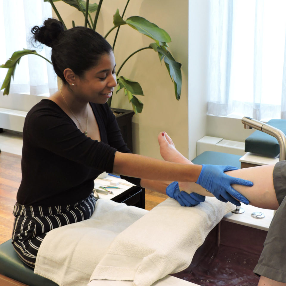 Customer receiving leg massage during pedicure