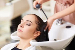 Woman getting hair done at the salon